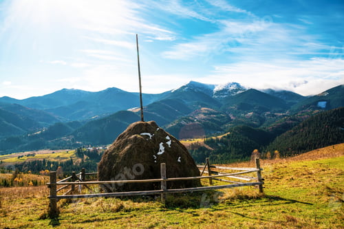 Preview: A large haystack against the backdrop of the wonderful nature of the Carpathians and the