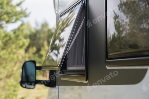 Preview: Close-up of a window in a motorhome, rest in a van