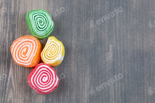 Preview: Colorful marmalade candies on wooden surface