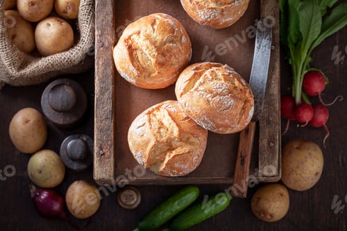 Preview: Tasty and fresh potato buns in wooden basement.