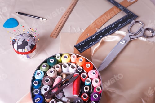 Preview: Sewing tools lie on the seamstress workplace