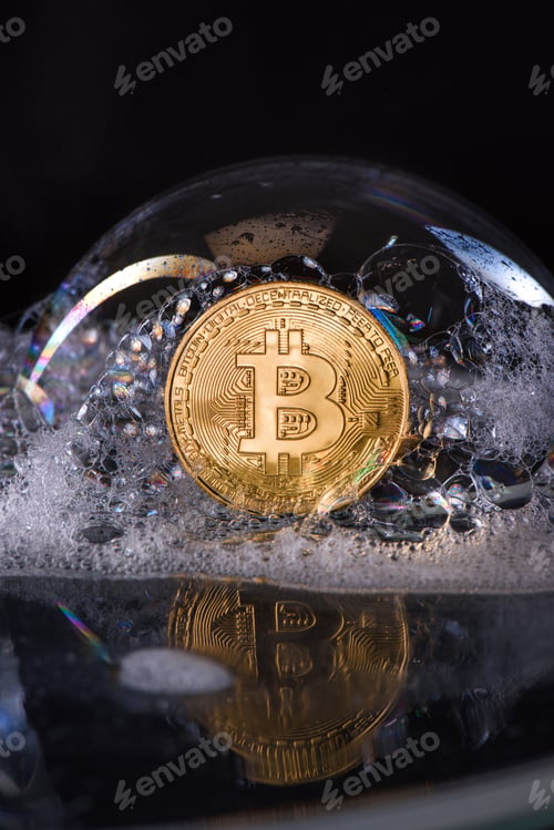 Preview: Close up view of golden bitcoin in soap bubble isolated on black