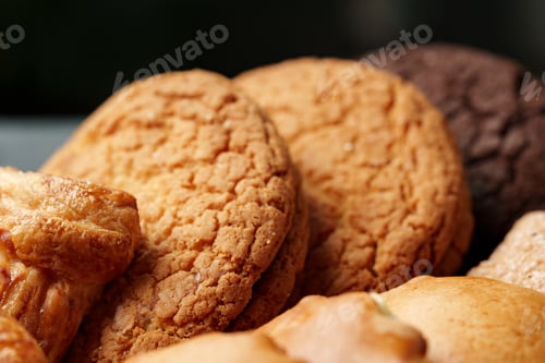 Preview: Assorted cookies displayed on a plate with various textures and colors in a warm setting