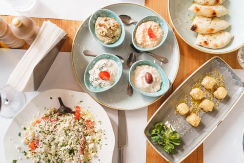 Preview: Wooden cafe table with different cooked dishes