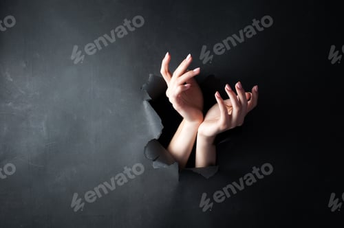 Preview: Female hands, on a black, torn background.