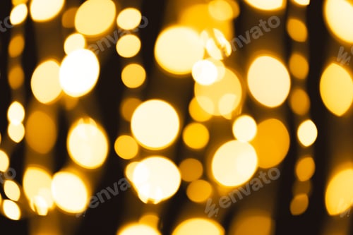 Preview: Multiple yellow bokeh lights with copy space on dark background