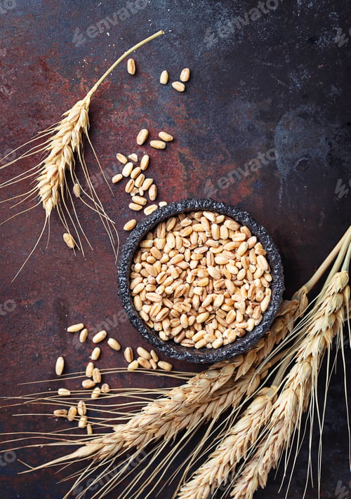 Preview: Wheat grains and spikelets on rusty background