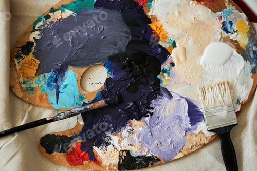Preview: Artist's Palette with Various Colors and Paintbrushes