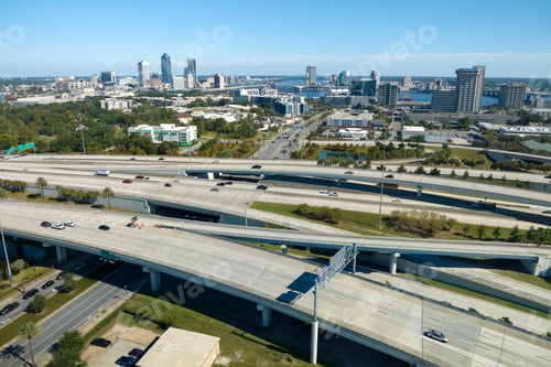 Preview: Aerial view of american freeway intersection with fast moving cars and trucks.