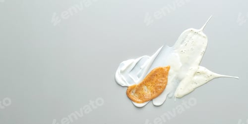 Preview: Composition of various cosmetic mask, creams, serum, scrubs and lotion smear on a gray background.