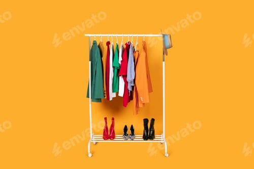Preview: Rack of Clothes on Yellow Studio Background