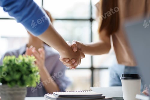 Preview: Business success. Business people shaking hands agreement confirmed in the investment business.