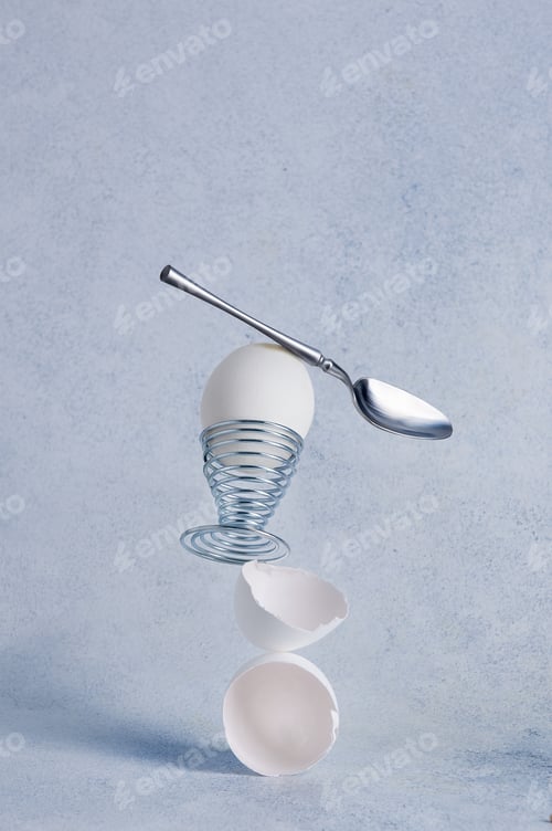Preview: Stable balancing structure of boiled egg, egg shell and dessert spoon.
