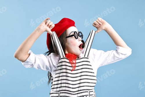 Preview: Emotional girl dressed like mime on light blue background. Surprise party