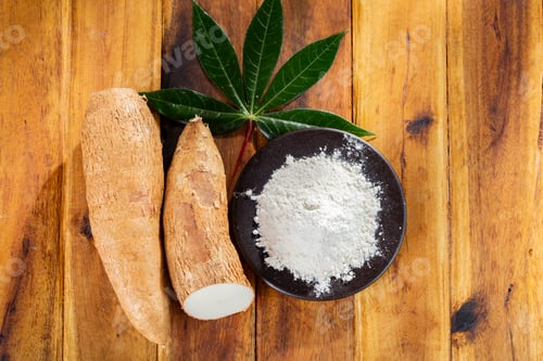 Preview: pile of cassava, and cassava flour on a background of rustic wood (Manihot esculenta)