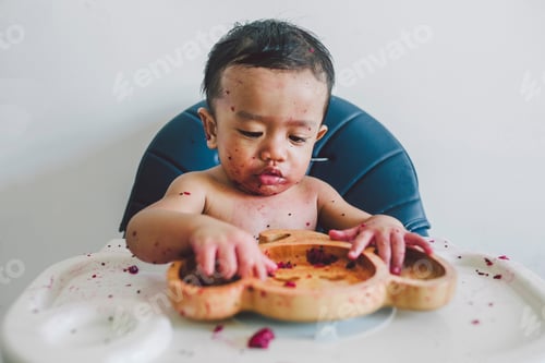 Preview: Playful Toddler Exploring Food with Hands