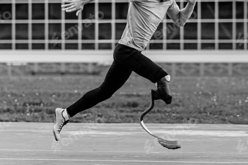 Preview: para-athlete running sprint race at athletics competition, black and white photo