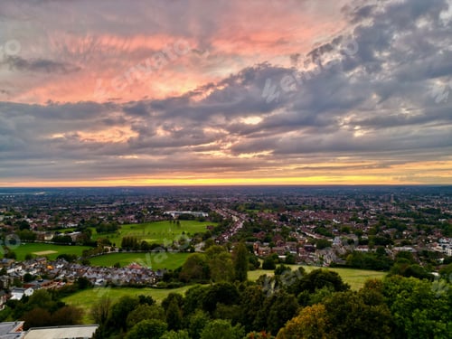 Preview: Cityscape of the London Harrow with mesmerizing cloud, United Kingdom, aerial