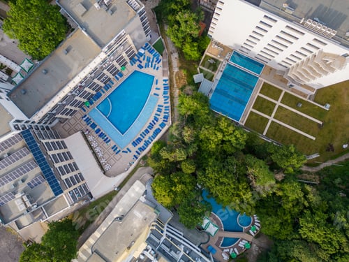 Preview: Aerial view of beautiful luxury outdoor swimming pool in hotel resort