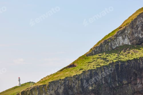 Preview: Mykines lighthouse and cliffs on Faroe islands. Hiking landmark