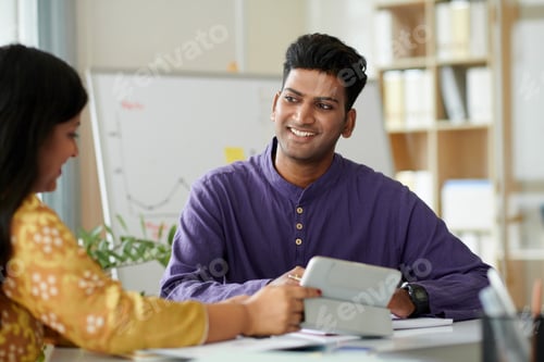 Preview: Businessman Listening to Speaking Colleague