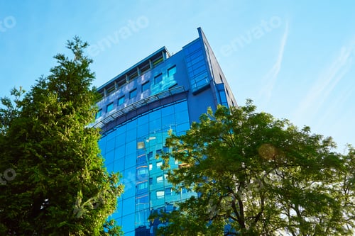 Preview: Modern office building with green trees