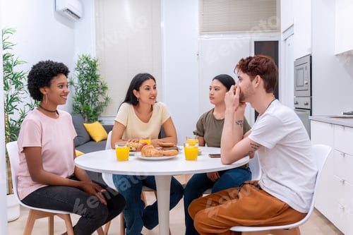 Preview: Friends Enjoying Breakfast Together in Modern Kitchen
