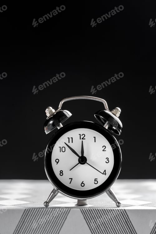 Preview: Vintage background with retro alarm clock on table