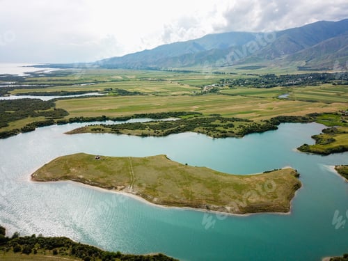Preview: Aerial view of herd of horses on a the uninhabited island