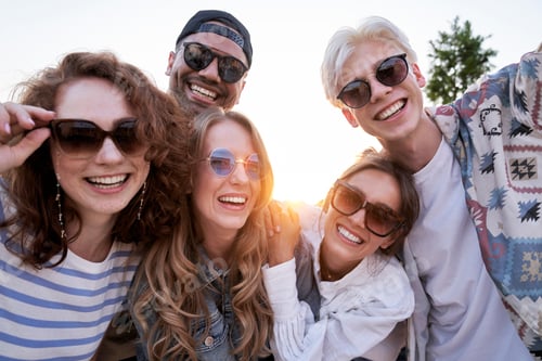 Preview: Portrait of group of multi ethnicity friends during the sunset