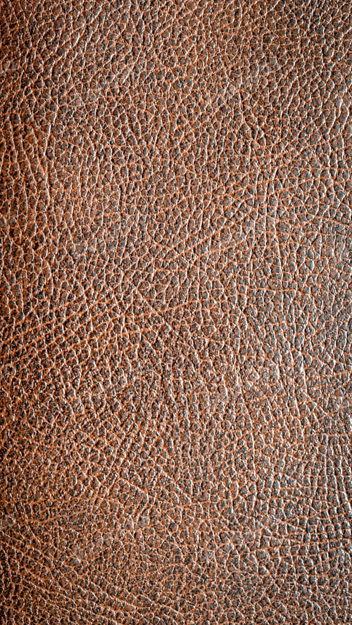 Preview: brown faux leather with visible details. background