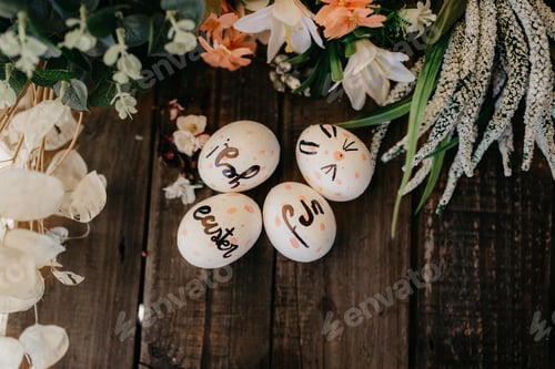 Preview: Easter eggs hand painted by children with messages in a wooden table