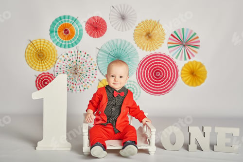 Preview: Smash cake party. Little cheerful birthday boy with first cake.