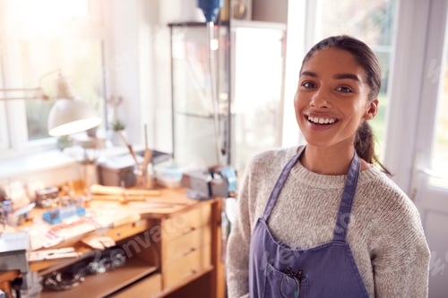 Preview: Portrait Of Smiling Female Jeweller At Bench Working In Studio