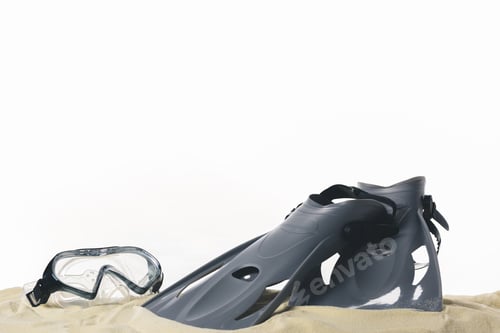 Preview: Mask and flippers in sand isolated on white