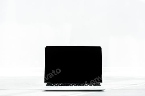 Preview: laptop with blank screen on wooden table on white