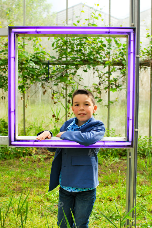 Preview: Cool boy of generation Z with neon light mirror - attitude portrait costume pose smile emotion