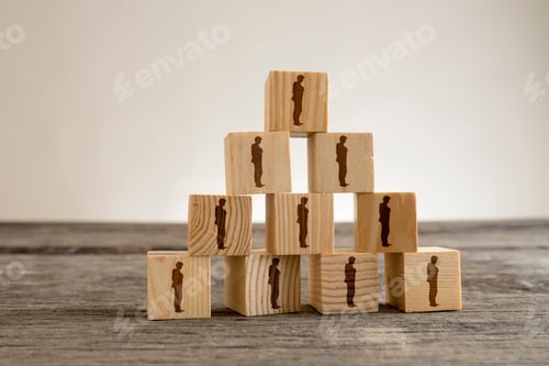 Preview: Blocks with businessman silhouettes structured into a pyramid