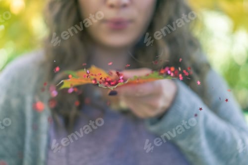 Preview: Girl blowing on glitter