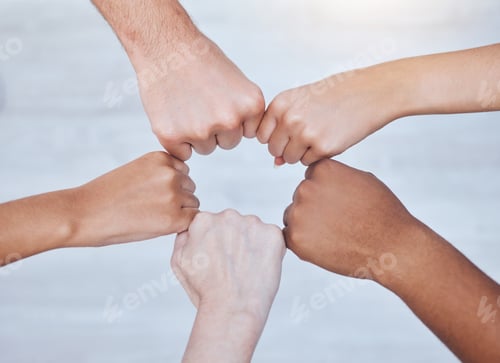Preview: Fist bump, unity and support group touching hands in a circle at a community therapy session. Top v