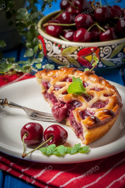 Preview: Homemade cherry pie on blue table.