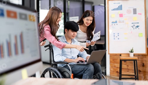 Preview: diverse team of professionals collaborate on a project while looking at a laptop in a modern office.