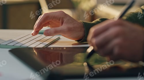 Preview: Man hand drawing stylus digital tablet cabinet closeup. Artist typing keyboard