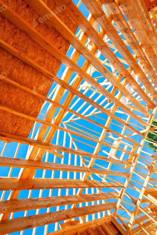 Preview: Wooden beams are arranged in triangular rectangular patterns, suggesting early stages of a roof