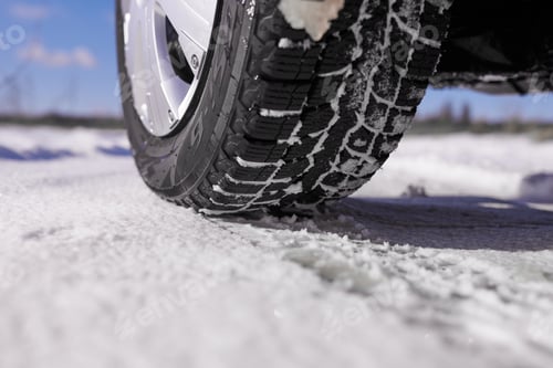 Preview: Car tires on winter snow road