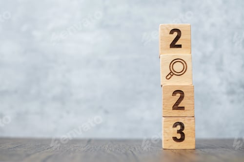 Preview: 2023 block with magnifying glass icon.