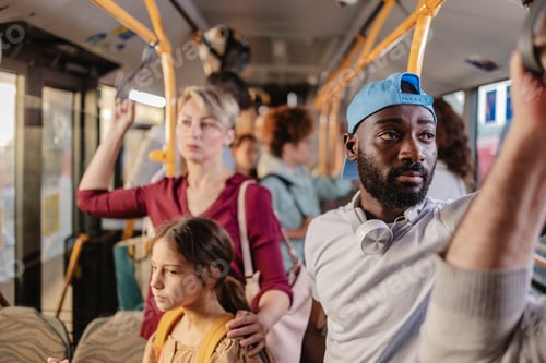 Preview: Passengers holding on to handrails while riding public transport bus