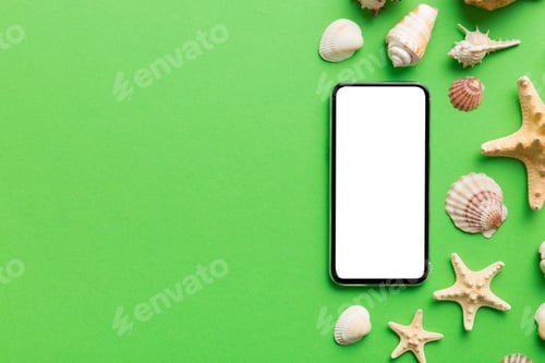 Preview: Flat lay composition with Phone and beach accessories on colored background. Smartphone blank screen