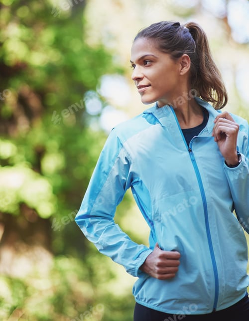 Preview: Getting back to nature. Shot of a young woman out for a trail run.