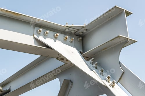Preview: Bolts and nuts on metal plates of steel structure of heavy duty straight crossbar of frame